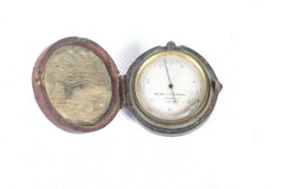 A Negretti & Zambra pocket mountain barometer.