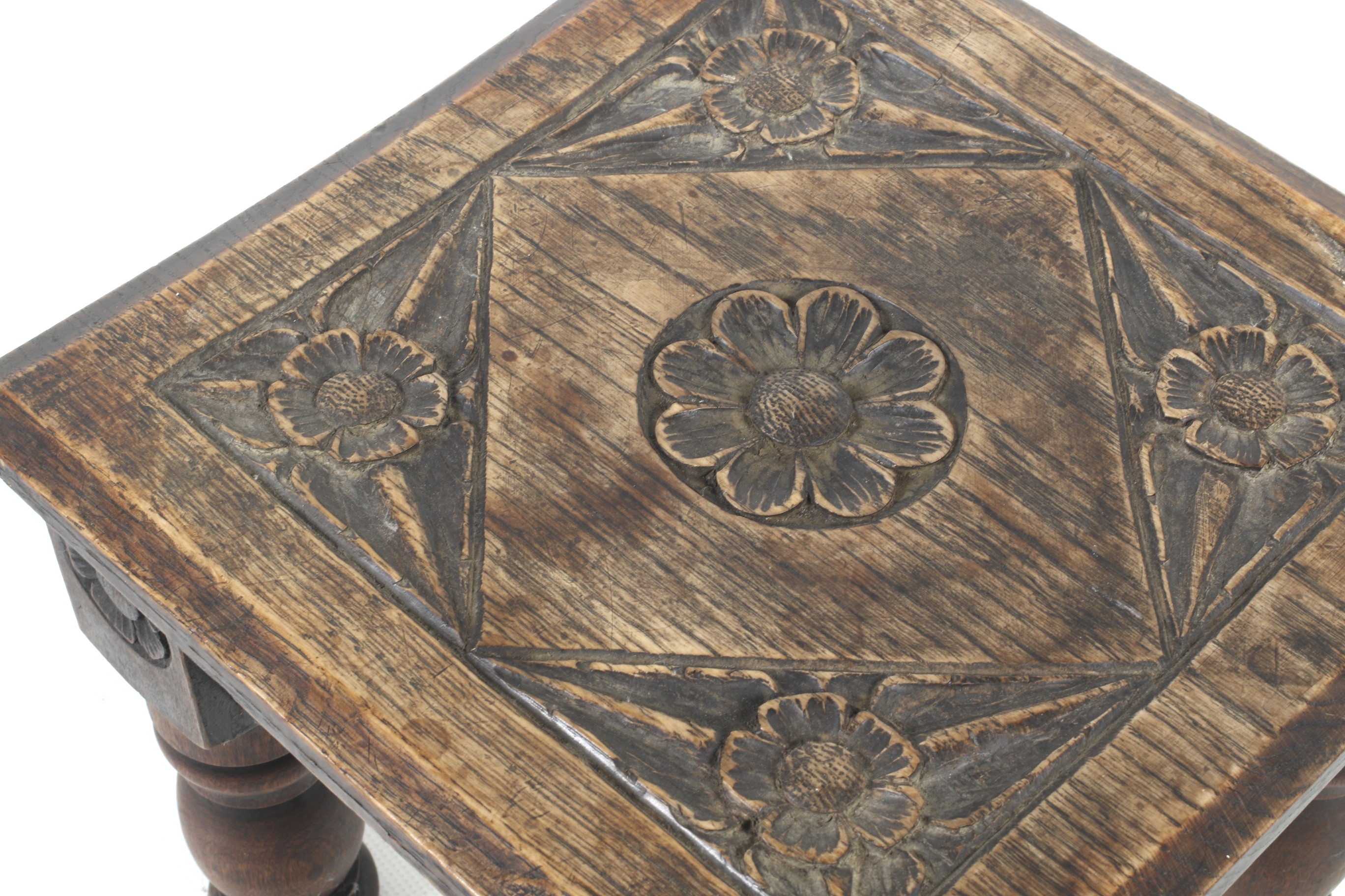 A 19th century carved oak stool from Street Church, Somerset. - Image 2 of 2