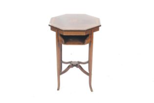 A Victorian inlaid mahogany table.