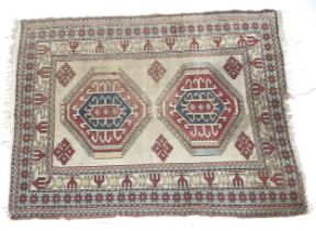 A Kilim style woollen rug.