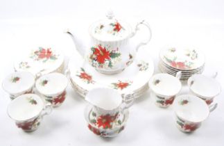 A collection of twenty piece Royal Albert Yuletide pattern tea dinner service.