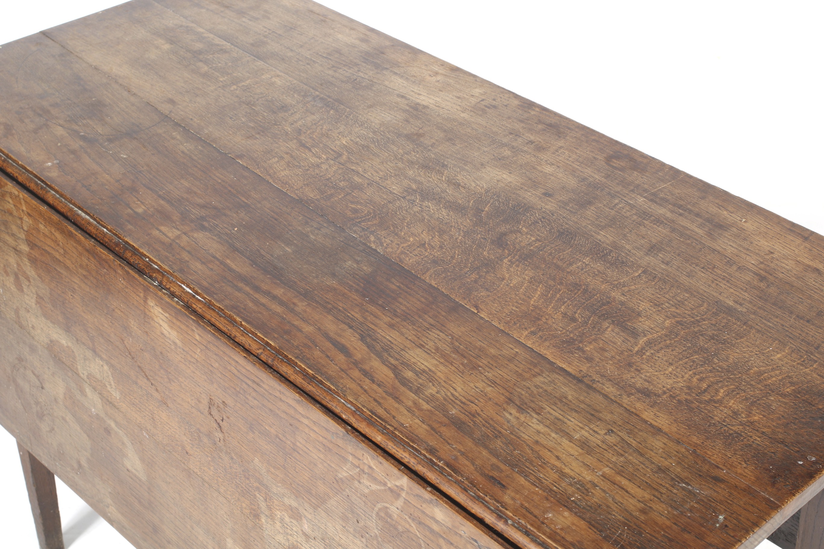 An antique oak drop leaf dining table. With square tapering supports. - Image 2 of 2
