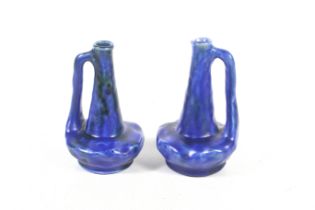 A pair of Bretby single handle vases.