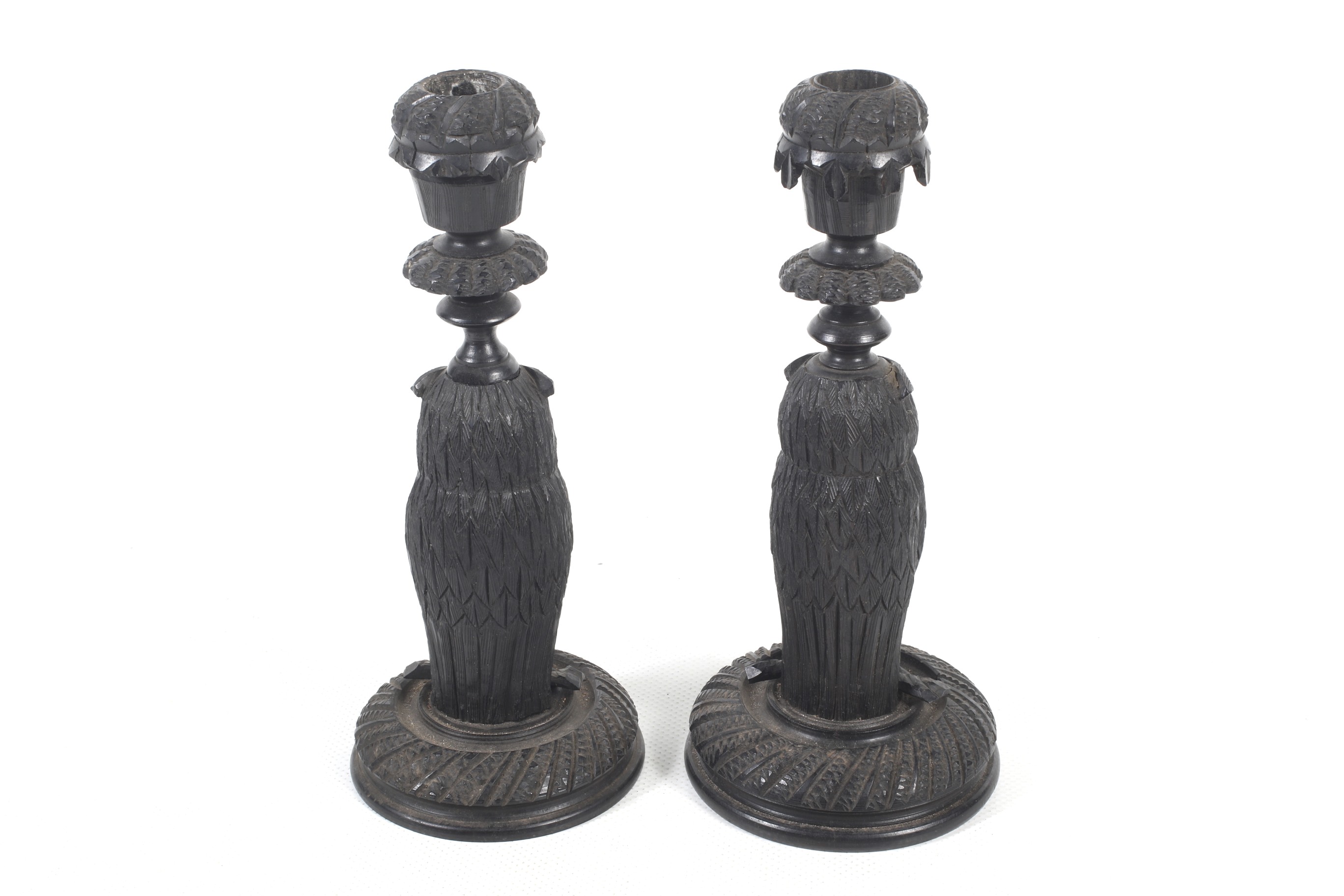 A pair of carved bog oak candlesticks. - Image 2 of 2