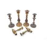 A group of assorted candlesticks.