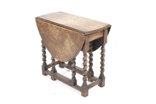 A Victorian oak gateleg table.