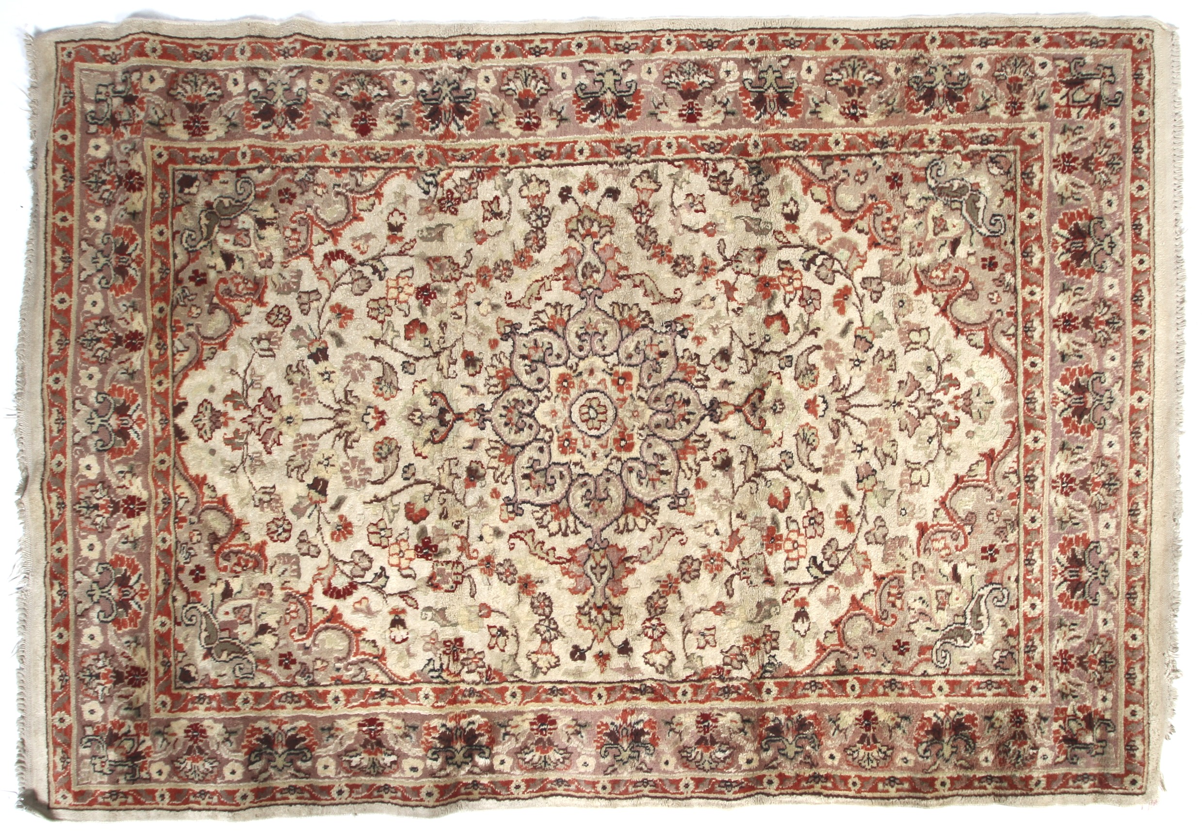 A 20th century rug. Cream ground rug with red decoration.