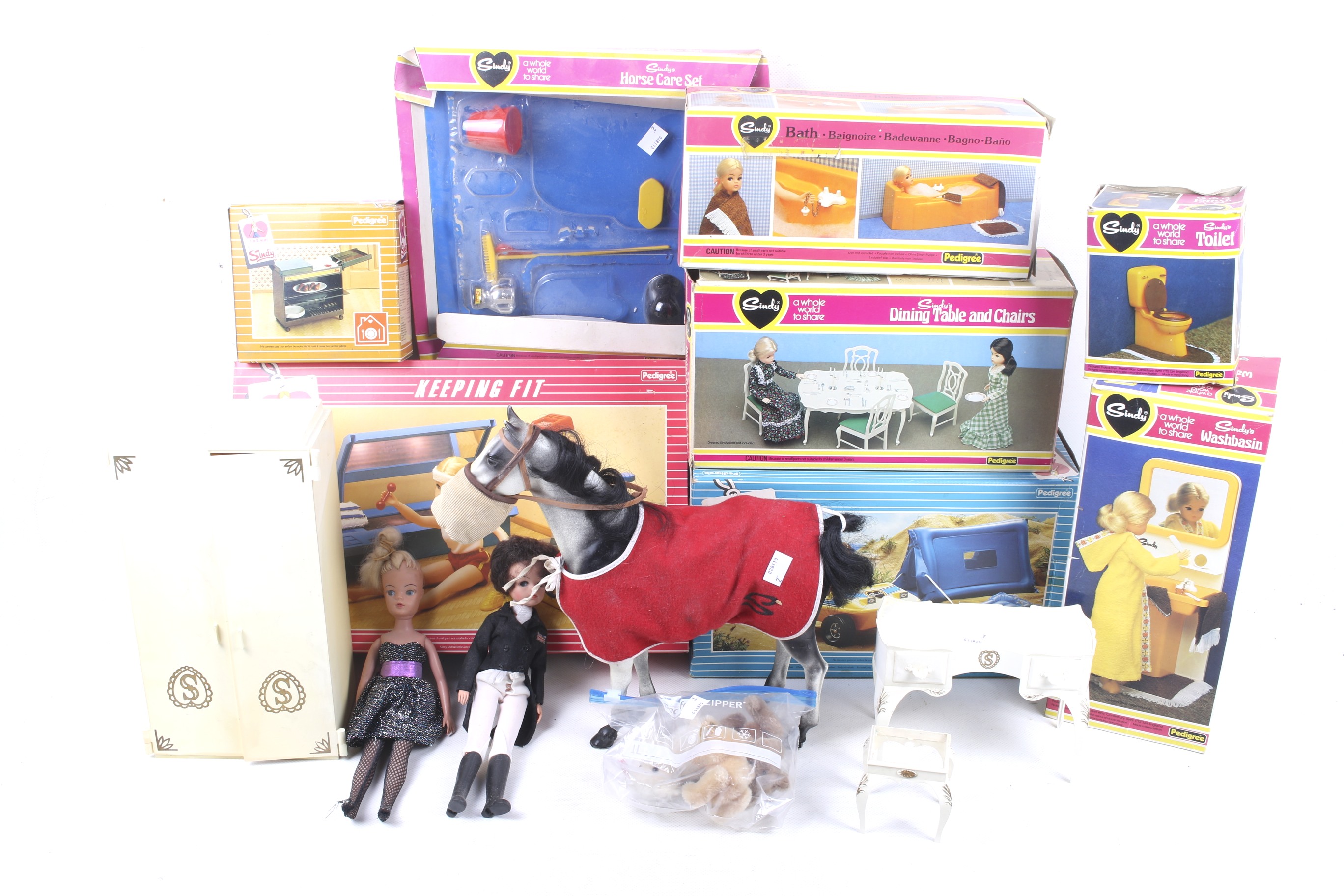 A collection of Sindy dolls and accessories.