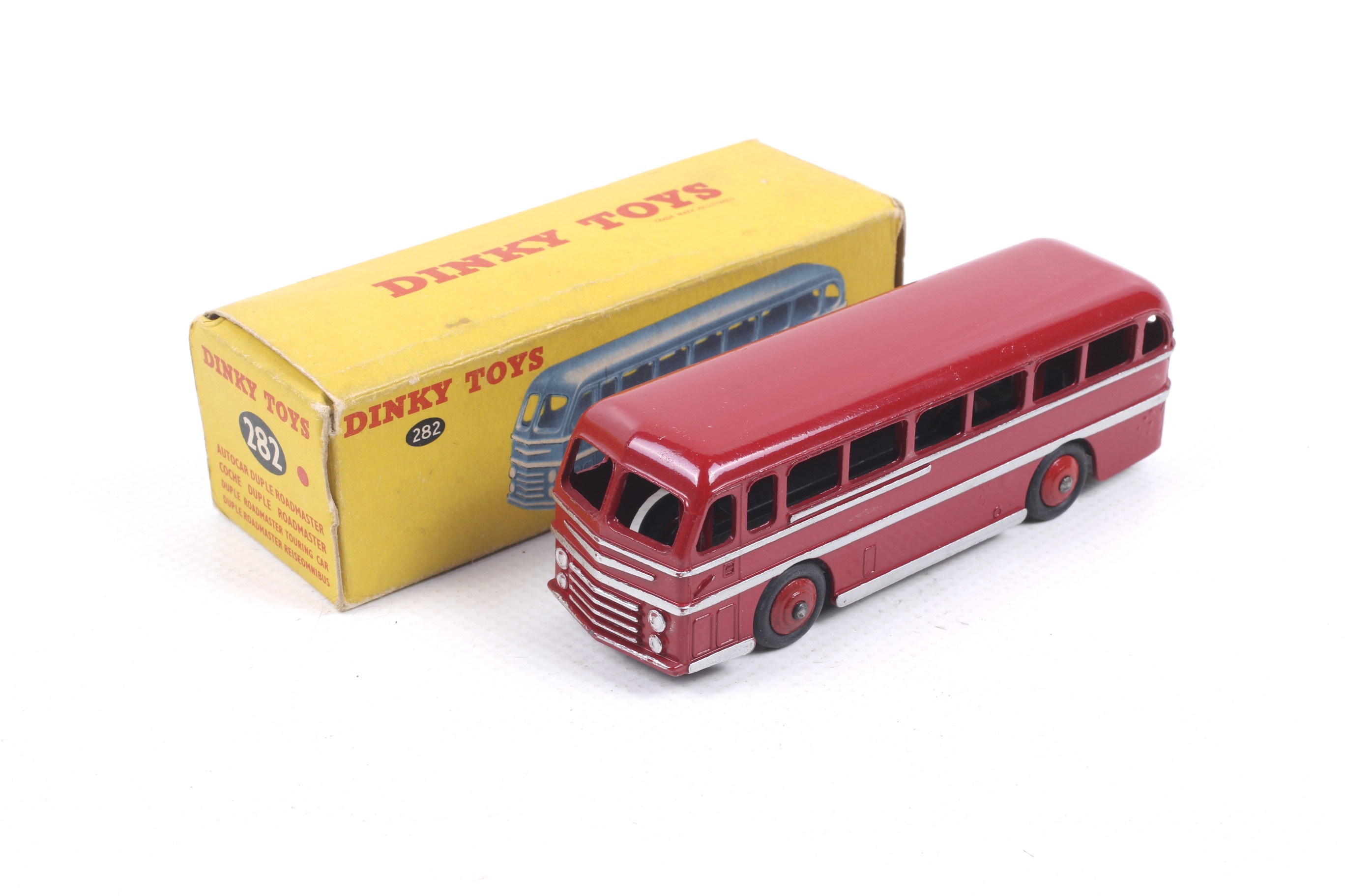 A Dinky diecast Duple Roadmaster Coach. No. 282, in red with silver trim, in original box.