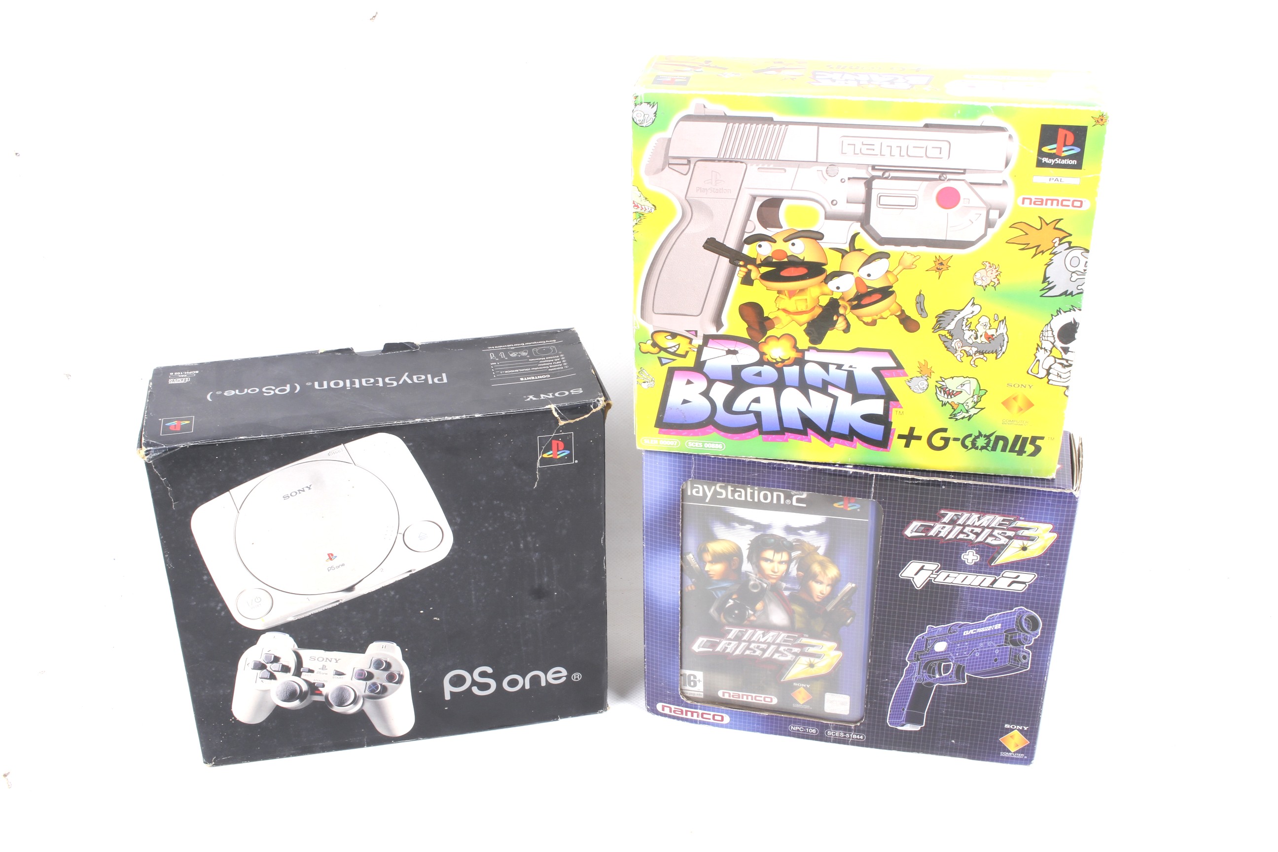 A Sony Playstation One games console and two games.