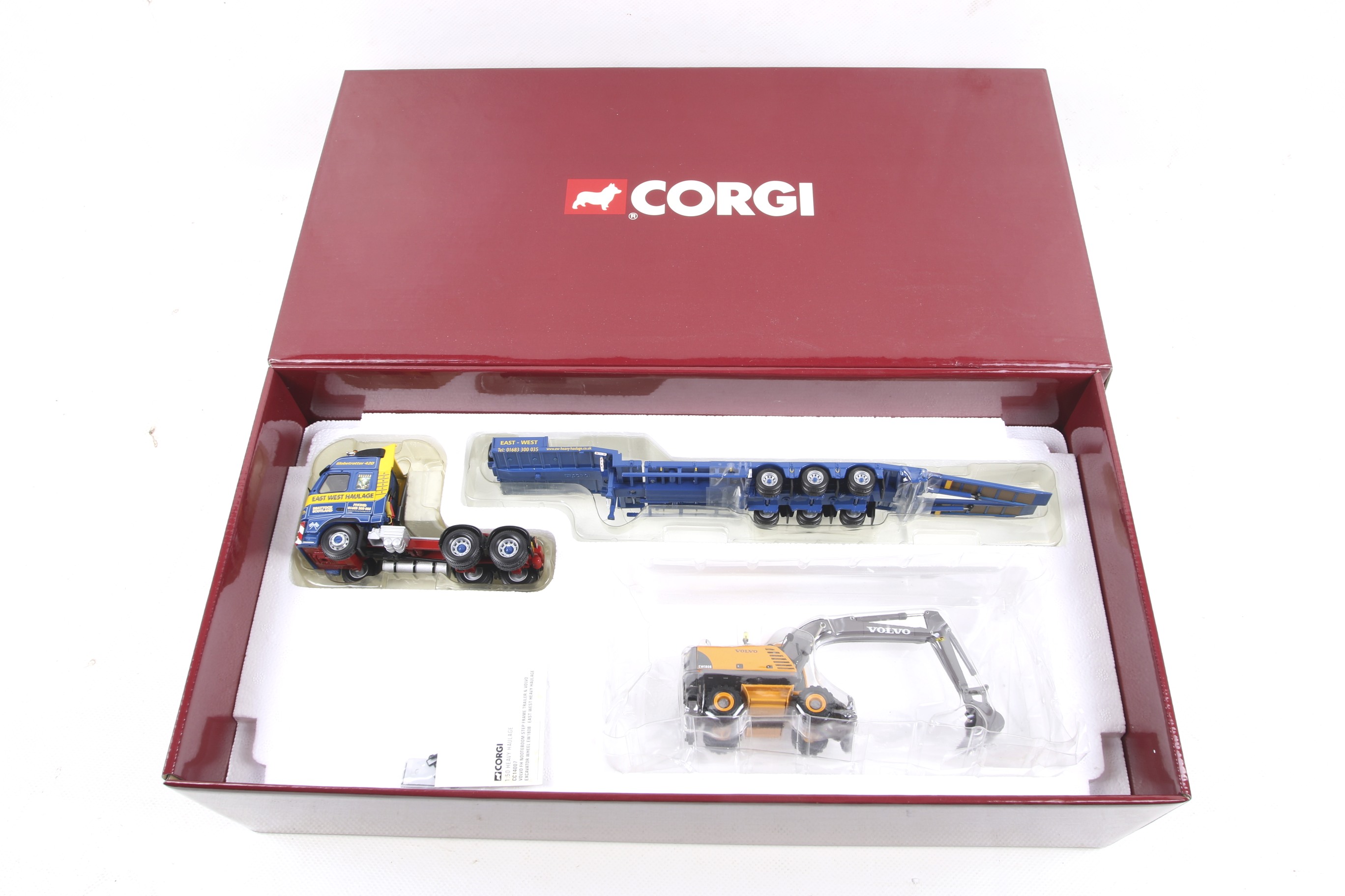 A Corgi Heavy Haulage 1:50 scale diecast Volvo FH Lorry and Trailer with a Volvo Excavator Wheel