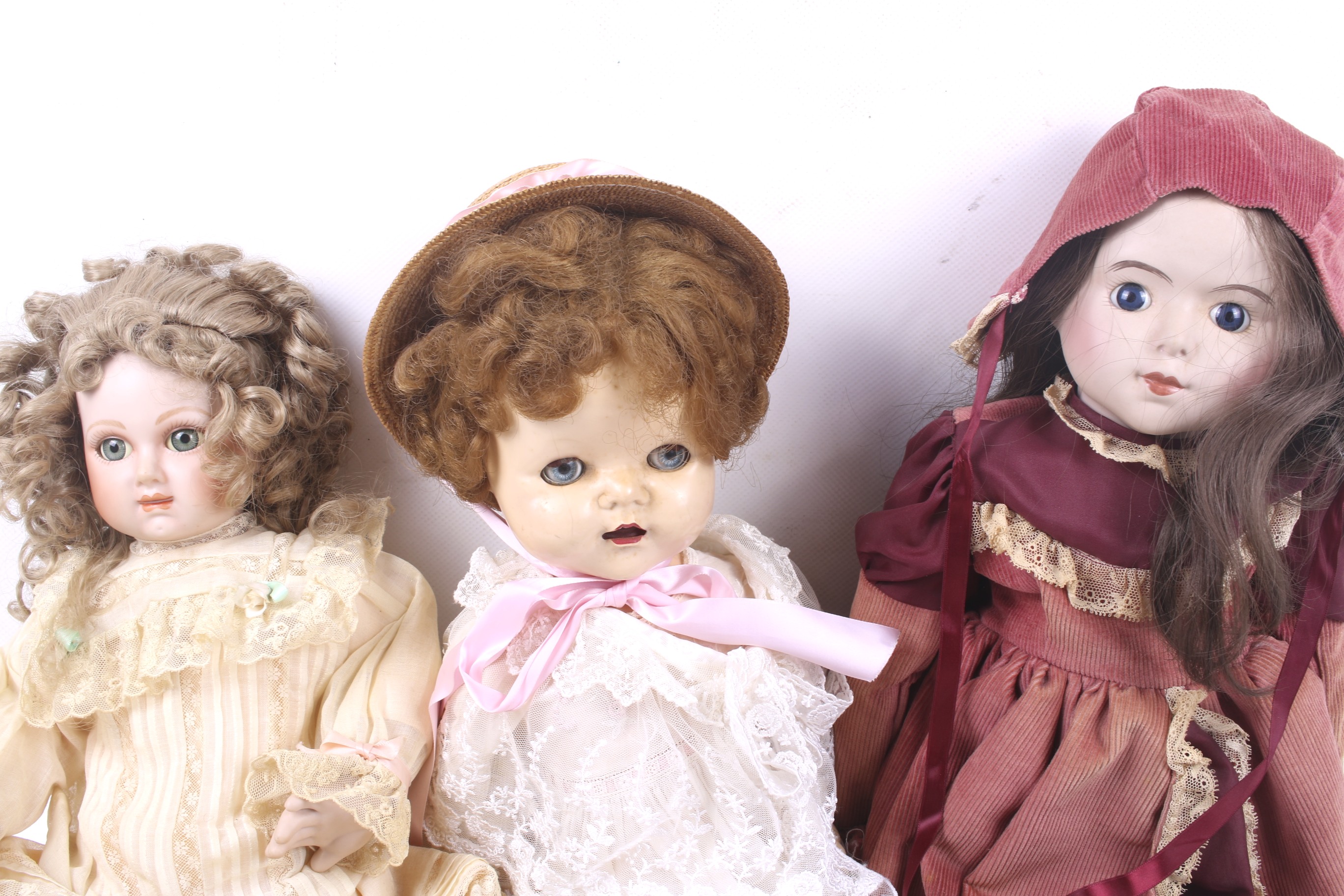 A collection of three dolls. In a range of outfits and head wear etc. - Image 2 of 3