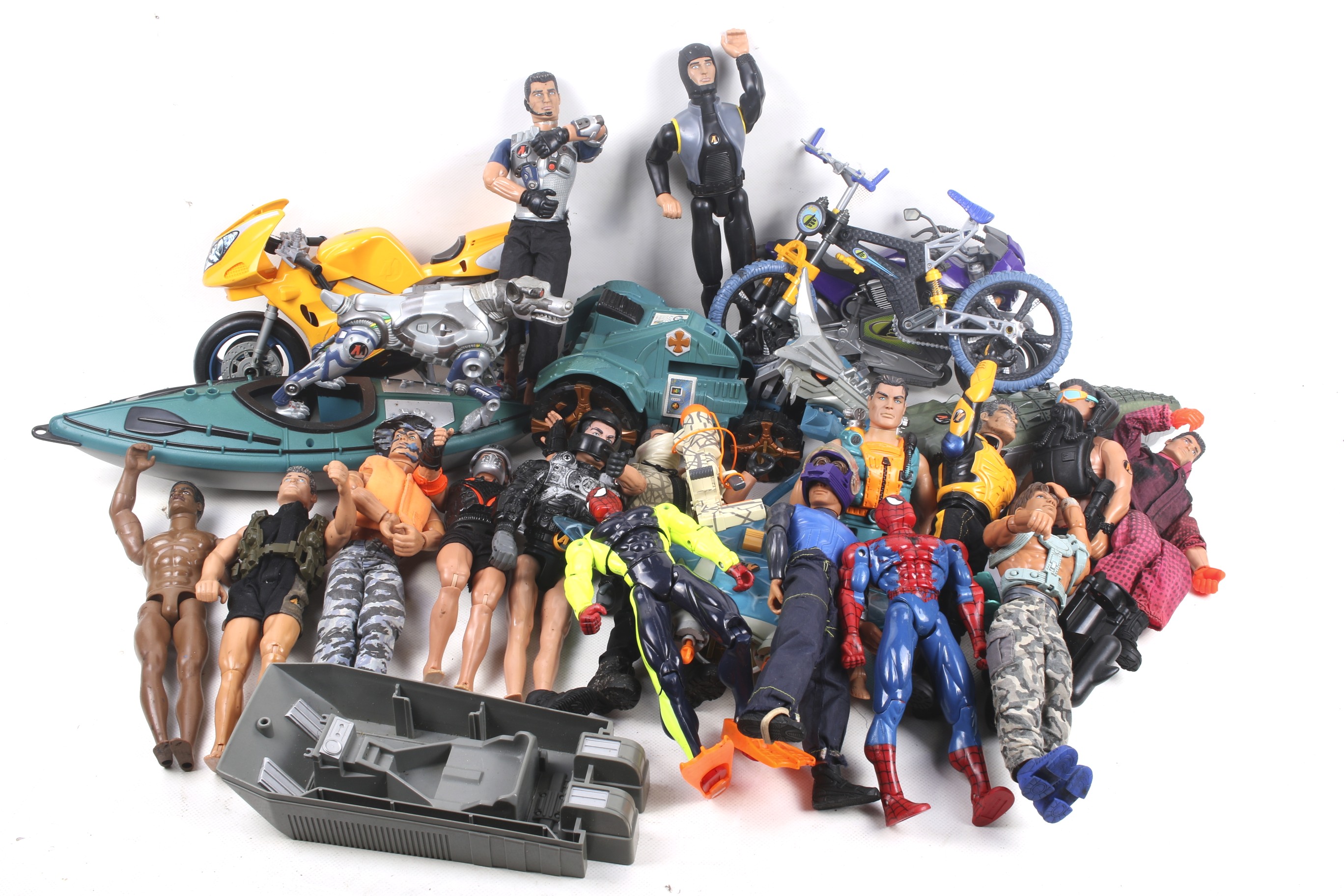 A collection of Action Man figures and vehicles. Noting a motorbike and canoe etc, all unboxed.