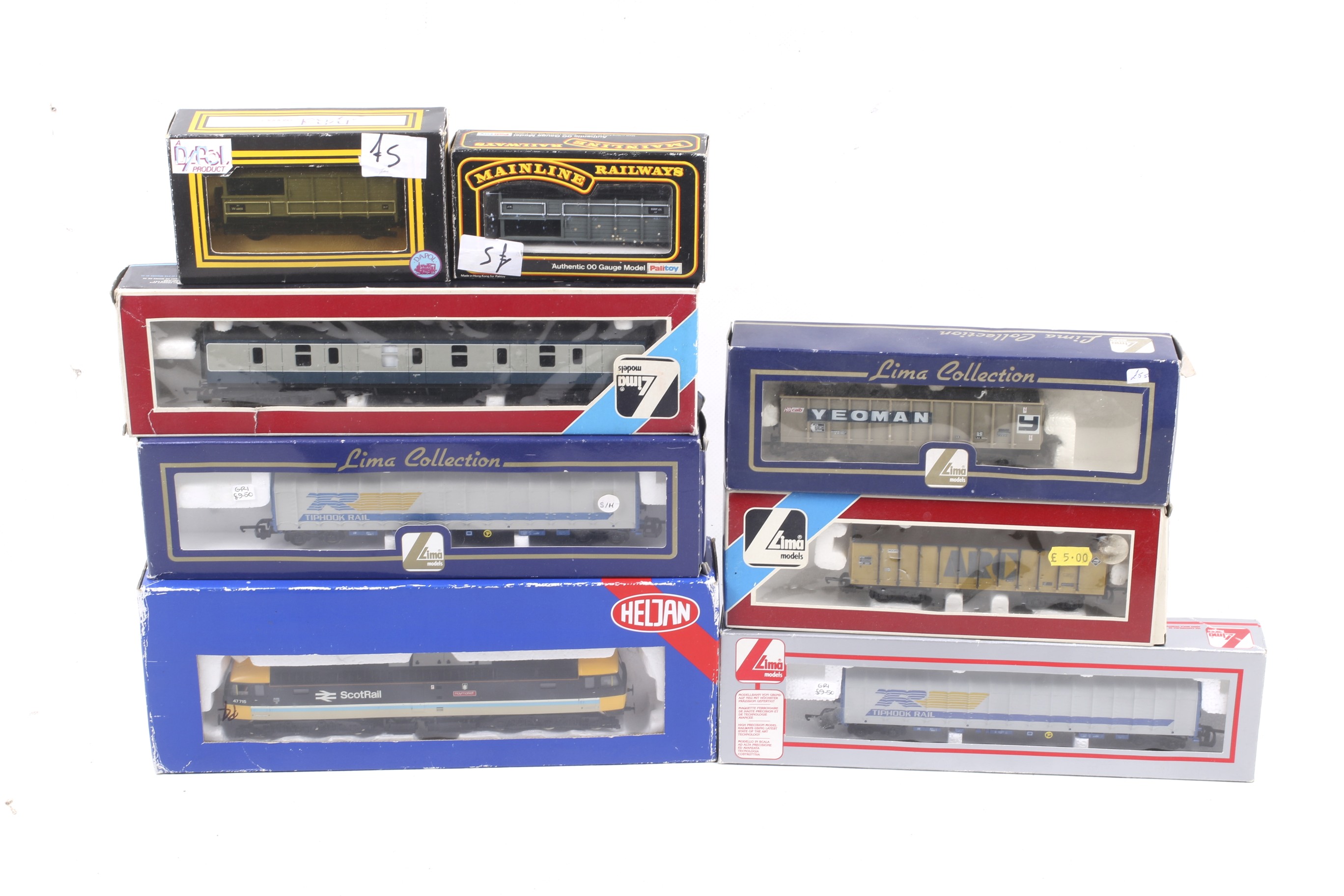 A mixed OO gauge collection of vehicles.