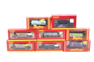 Eight Hornby OO gauge goods wagons. Including tankers, bulkers and flatbeds, all in original boxes.