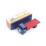 A Dinky diecast Guy Flatbed Truck. No. 512, with blue body and red bed, in original box.