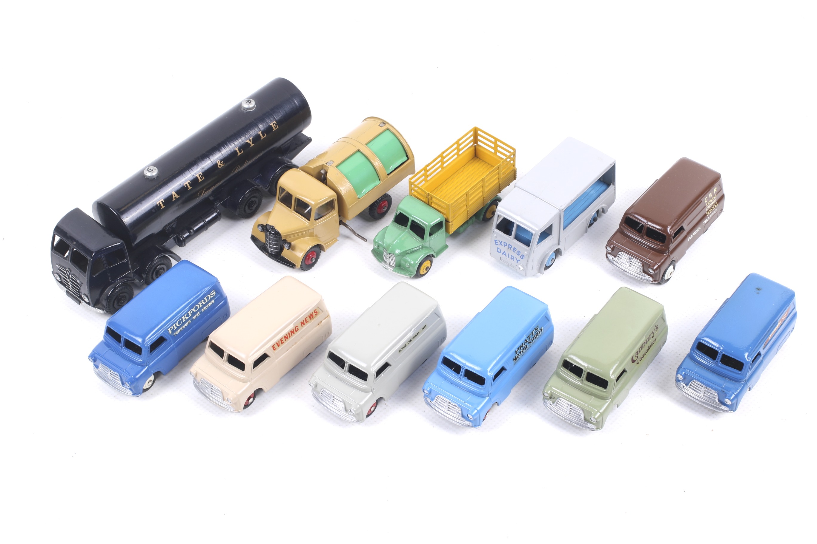 Twelve Dinky diecast vans and lorries. Noting many Bedford examples in a range of liveries, unboxed.