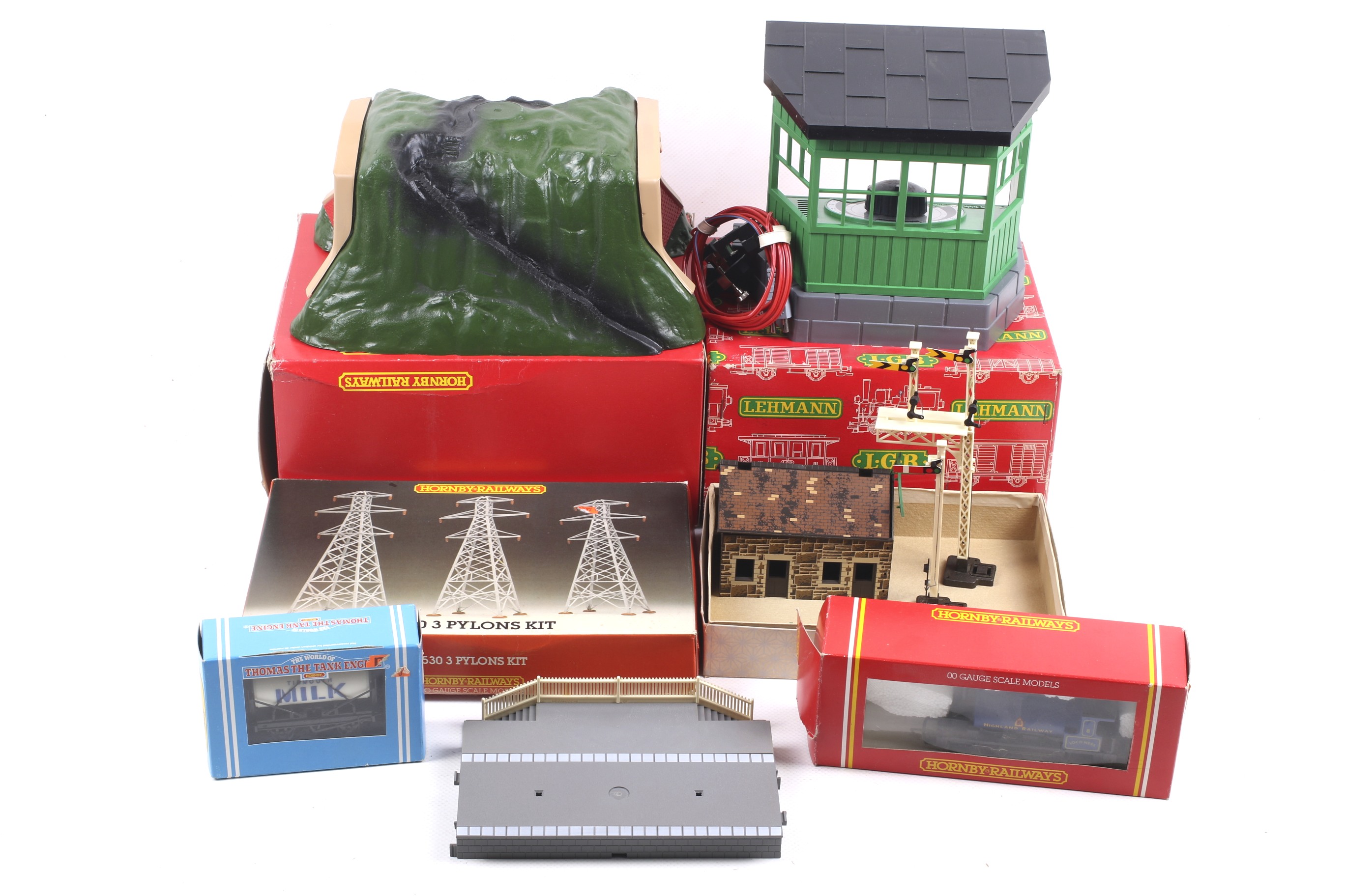 A collection of OO gauge railway accessories.