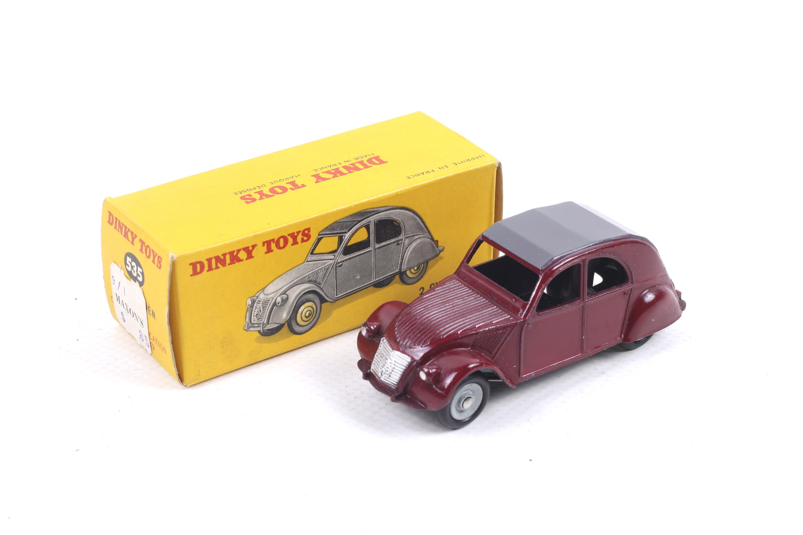 A Dinky diecast Citroen 2CV. No. 535, with red body and grey roof, in original box.