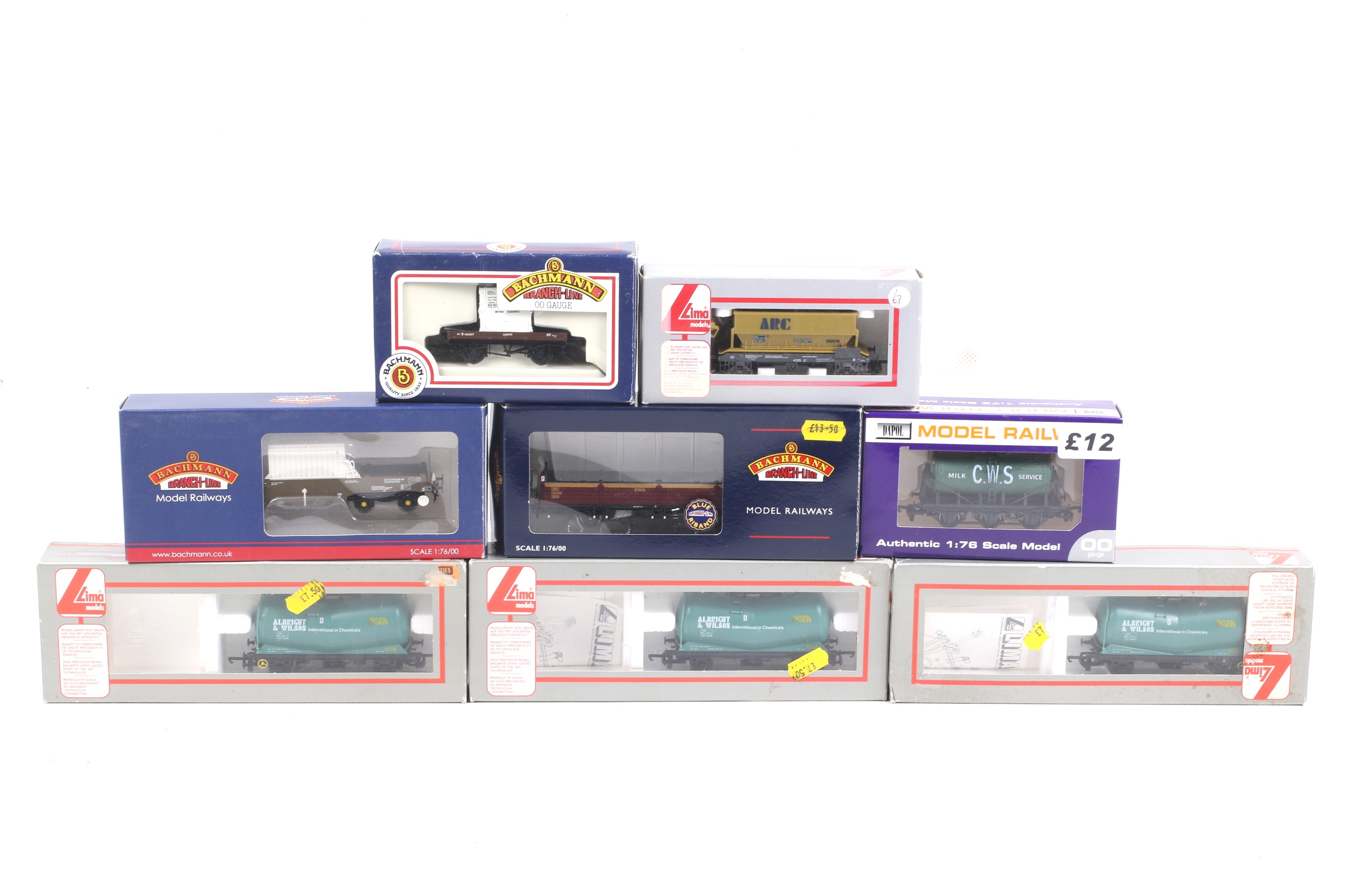 Eight OO gauge goods wagons. Including tankers, bulkers, flatbeds etc from Bachmann, Lima and Dapol.