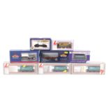 Eight OO gauge goods wagons. Including tankers, bulkers, flatbeds etc from Bachmann, Lima and Dapol.