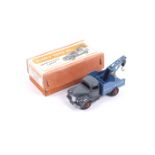 A Dinky diecast breakdown lorry. No. 25X with grey body and blue bed, in original box.