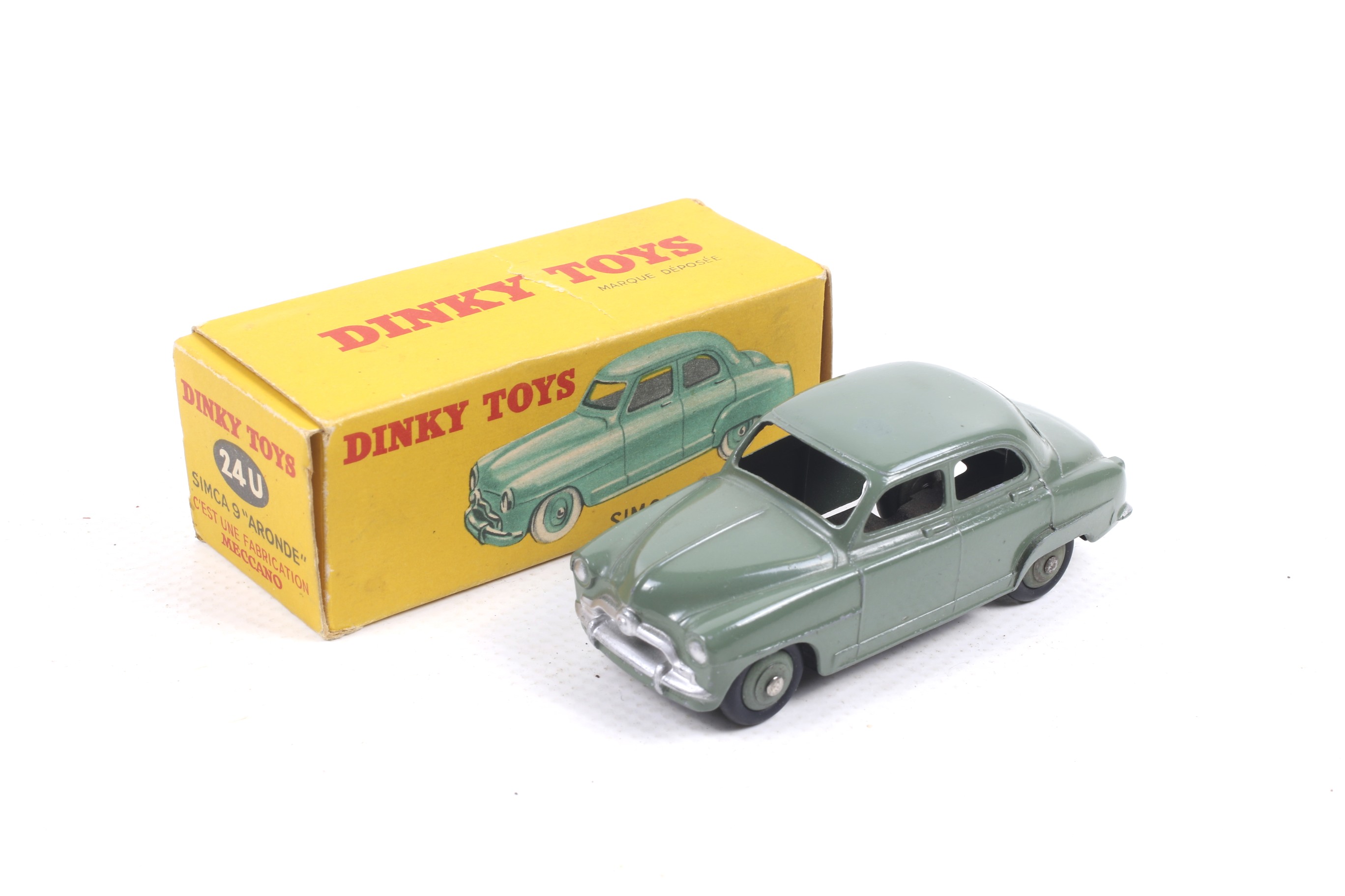 A French Dinky diecast Simca 9 'Aronde'. No. 24U, with green body and chrome trim, in original box.