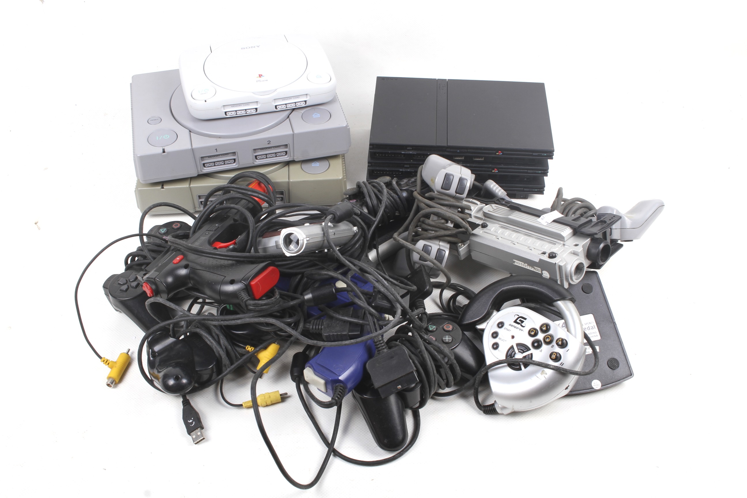 A collection of Playstation consoles and accessories.