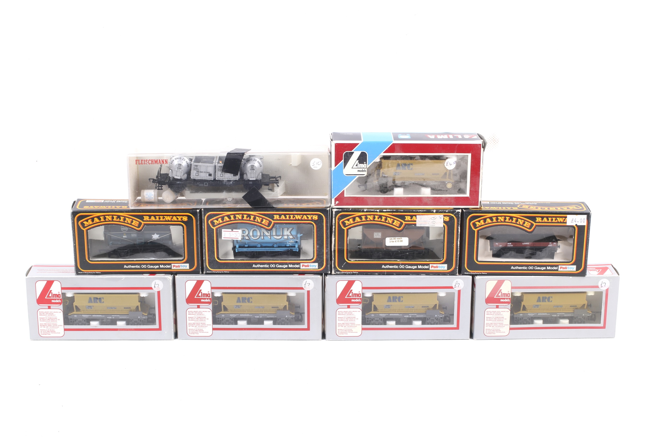 Ten OO gauge goods wagons. Including hoppers, tankers and flatbeds etc from Lima and Mainline.