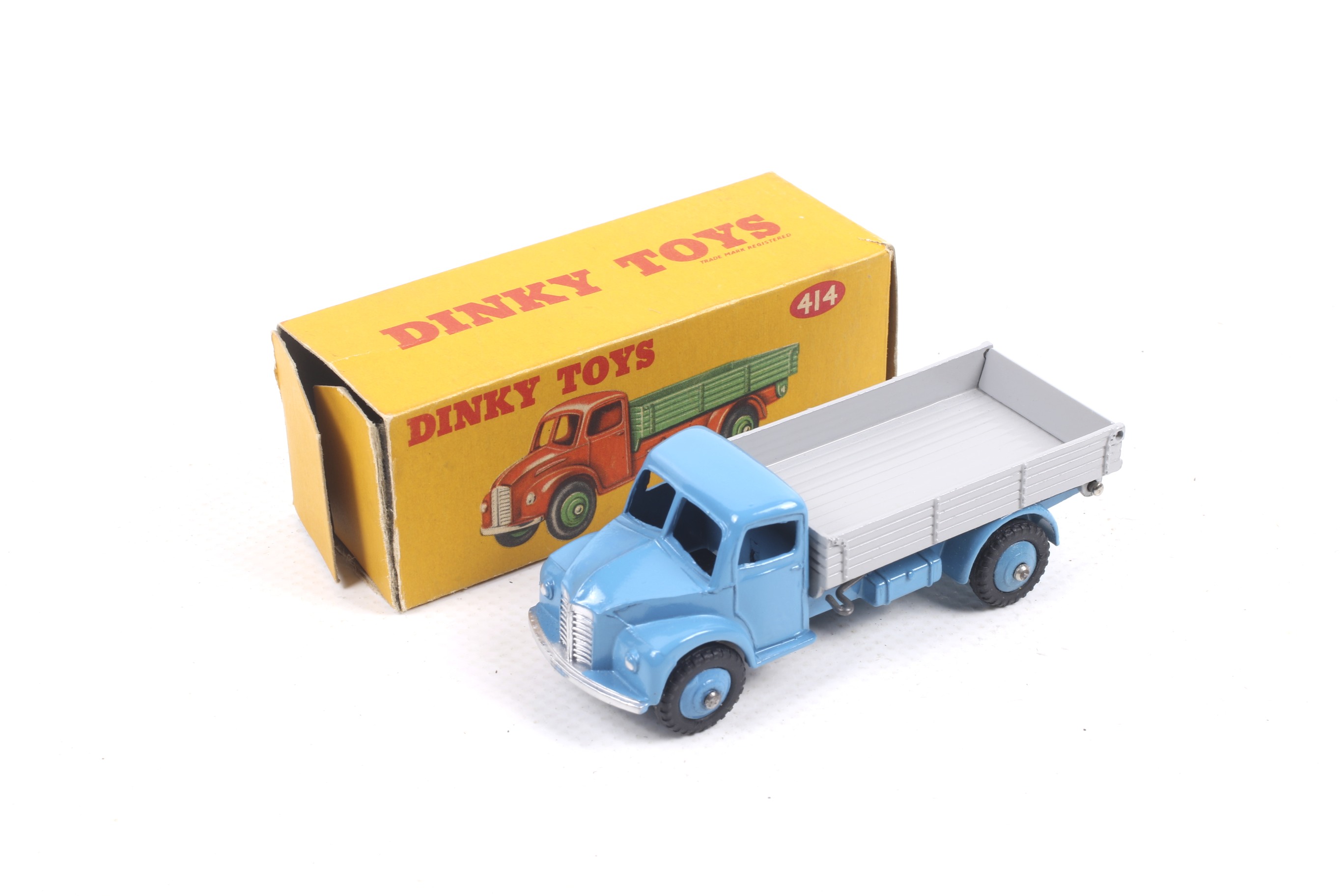 A Dinky diecast Rear Tipping Wagon. No. 414, blue body with grey bed, in original box.