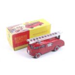 A Dinky diecast Fire Engine. No. 955, red body with chrome trim and ladder, in original box.