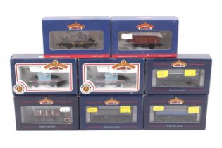 Eight Bachmann OO gauge goods wagons. Including box cars, flatbeds, etc. all in original boxes.