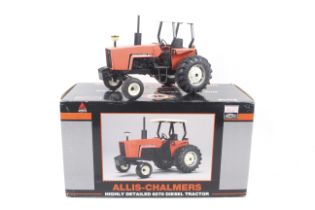 A 1:16 scale diecast Allis-Chalmers 6070 Diesel Tractor model. By Spec Cast, boxed.