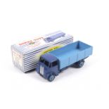 A Dinky diecast Guy 4-Ton Lorry. No. 911 dark blue lorry with light blue bed, in original box.