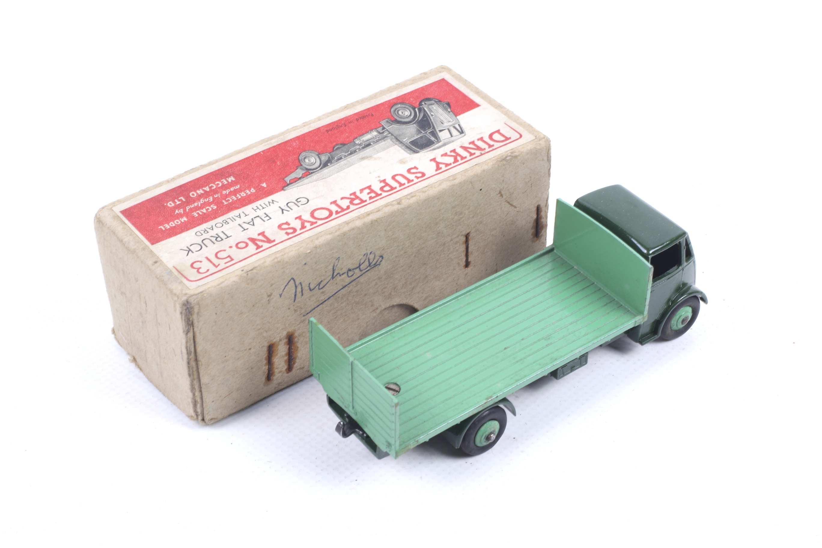 A Dinky diecast Guy Flatbed Truck. No. 513, dark green body with light green bed, in original box. - Image 2 of 2