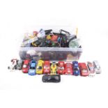 An assortment of slot car racing cars and accessories.