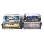 Four 1:18 scale diecast cars.