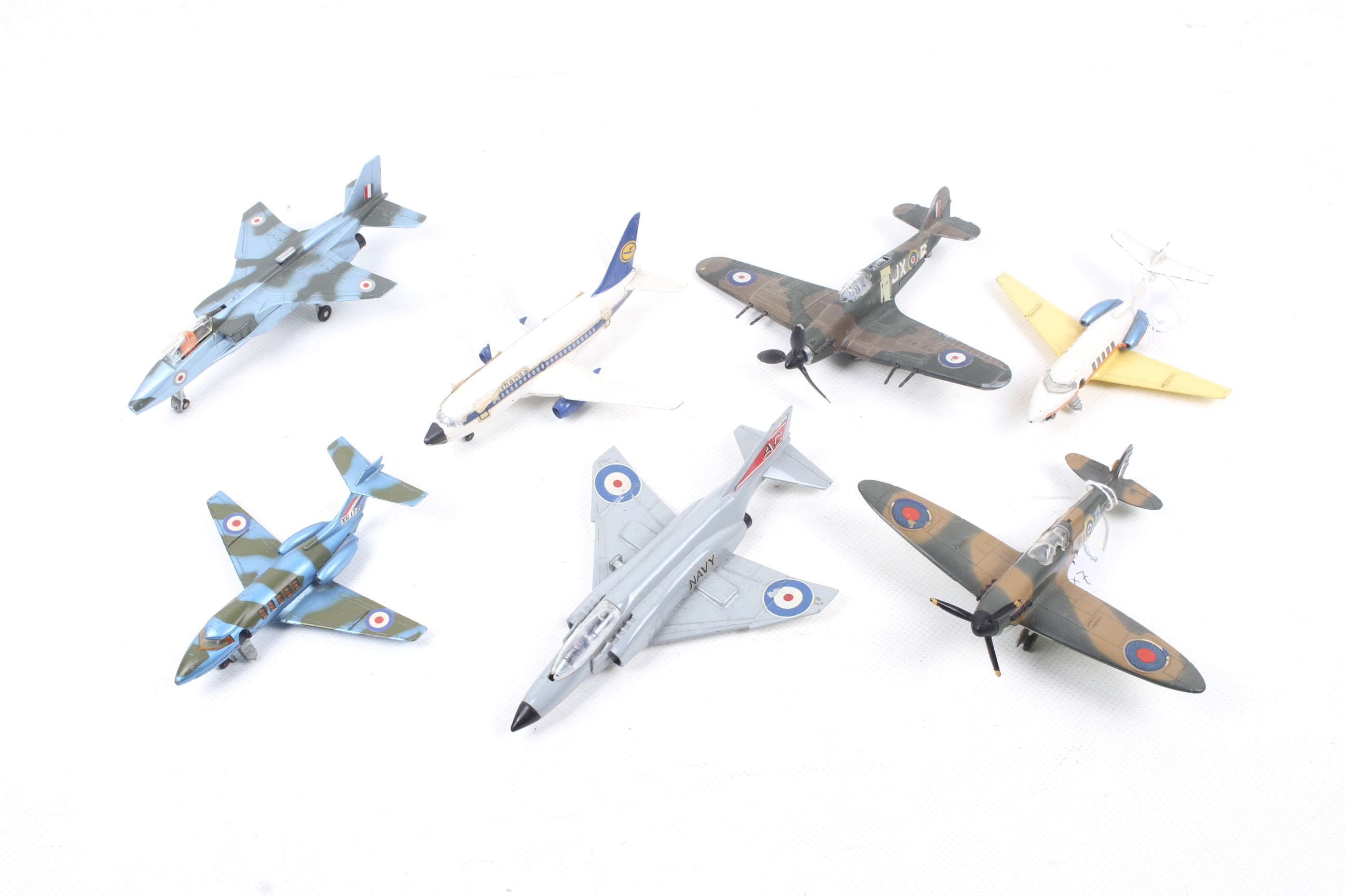 Seven Dinky diecast planes.