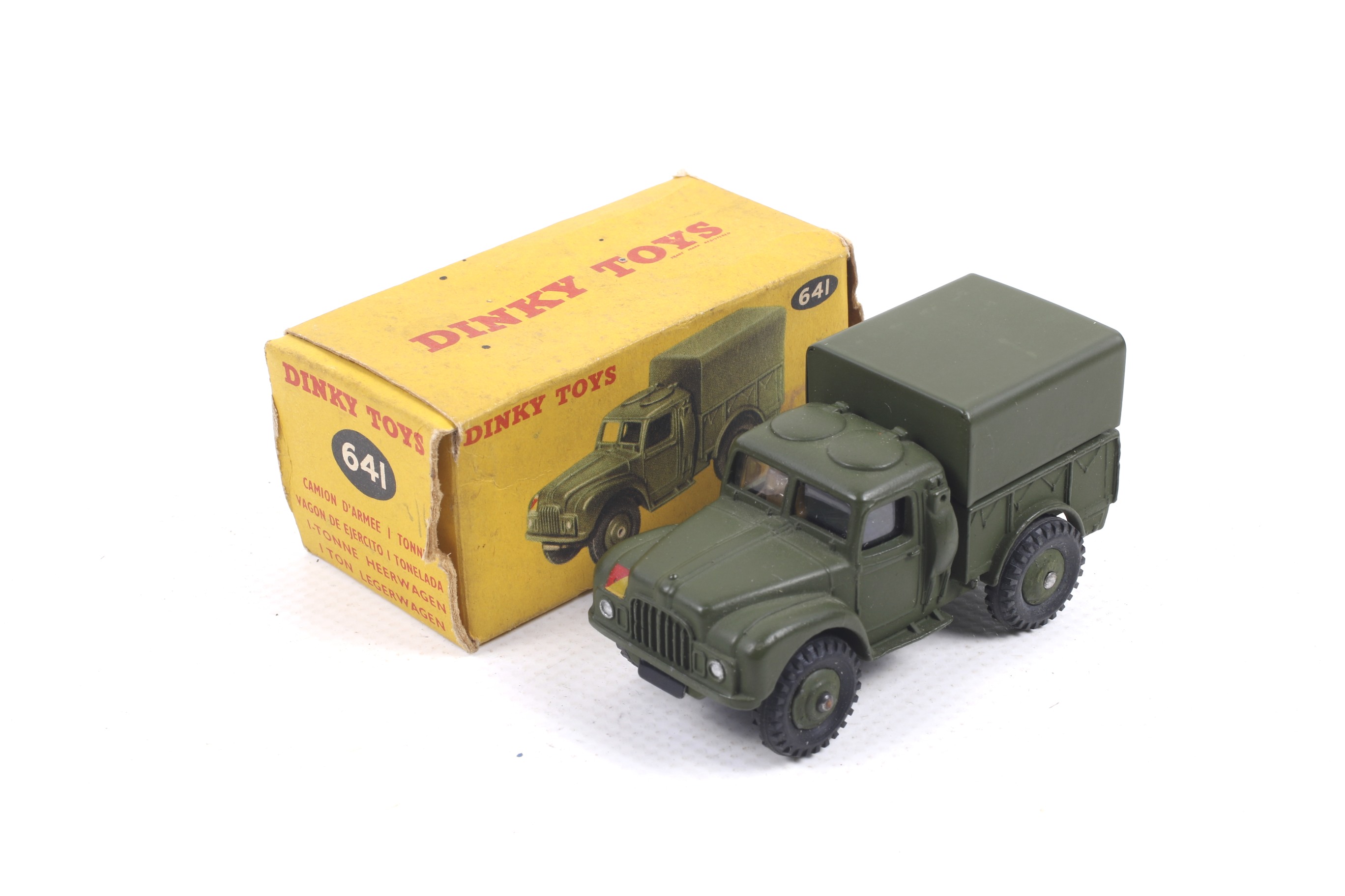 A Dinky diecast army 1 ton cargo truck. No. 641, with green body and black wheels, in original box.