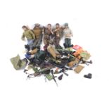 A collection of five action man figures and accessories.