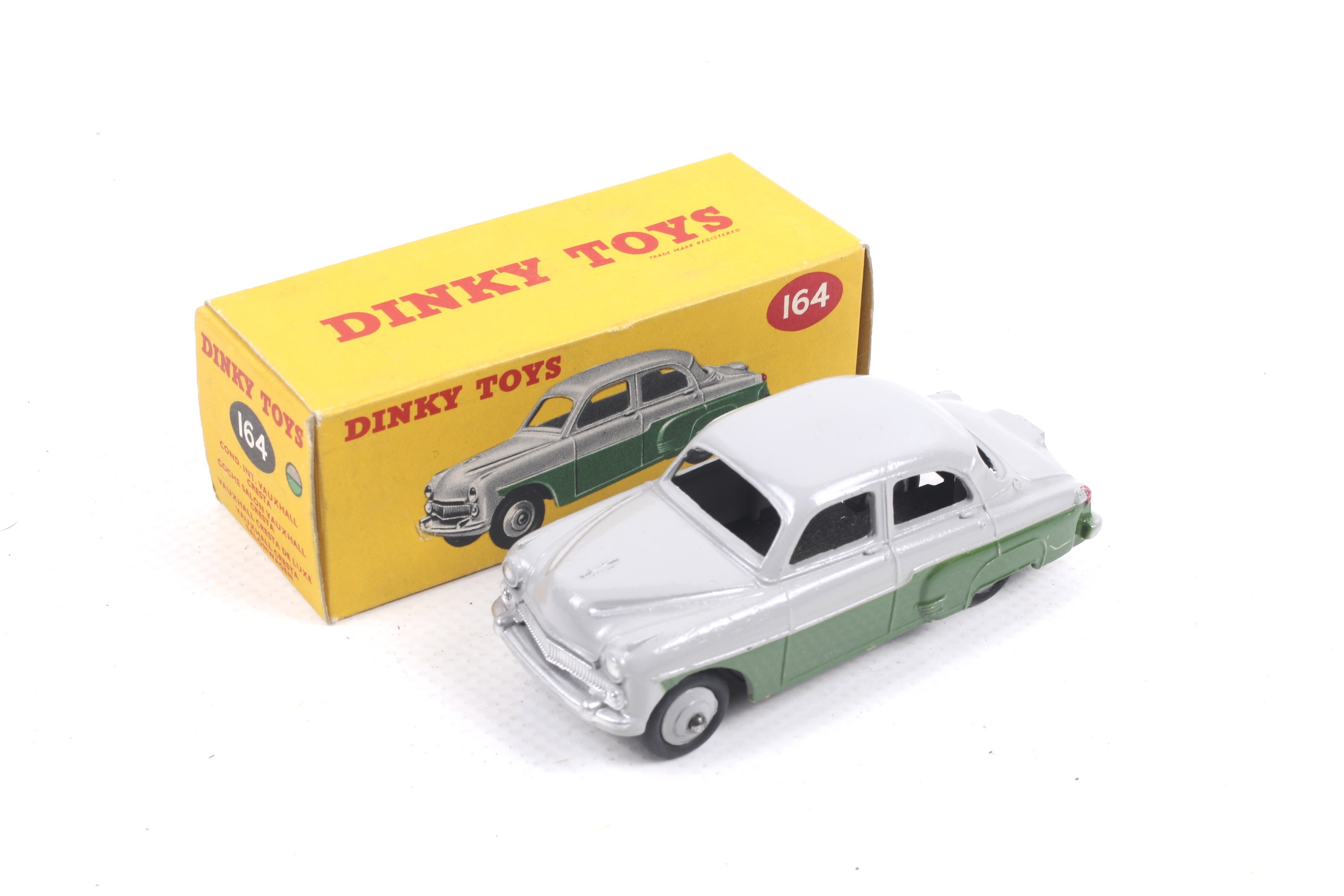 A Dinky diecast Vauxhall Cresta Saloon. No. 164, with two tone grey and green body, in original box.