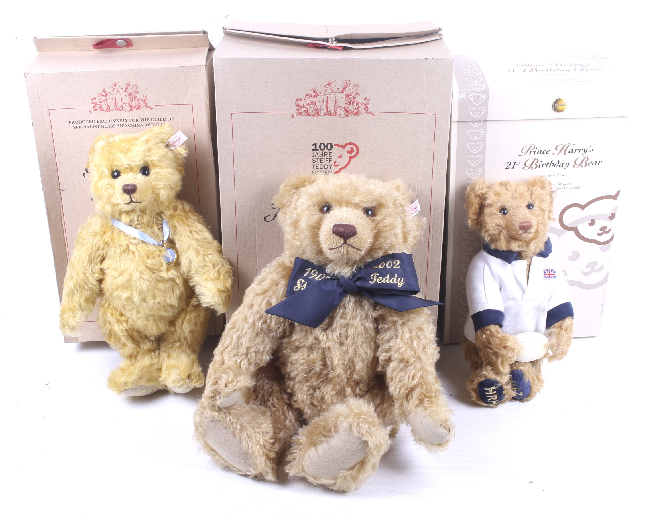 A collection of three Steiff teddy bears.