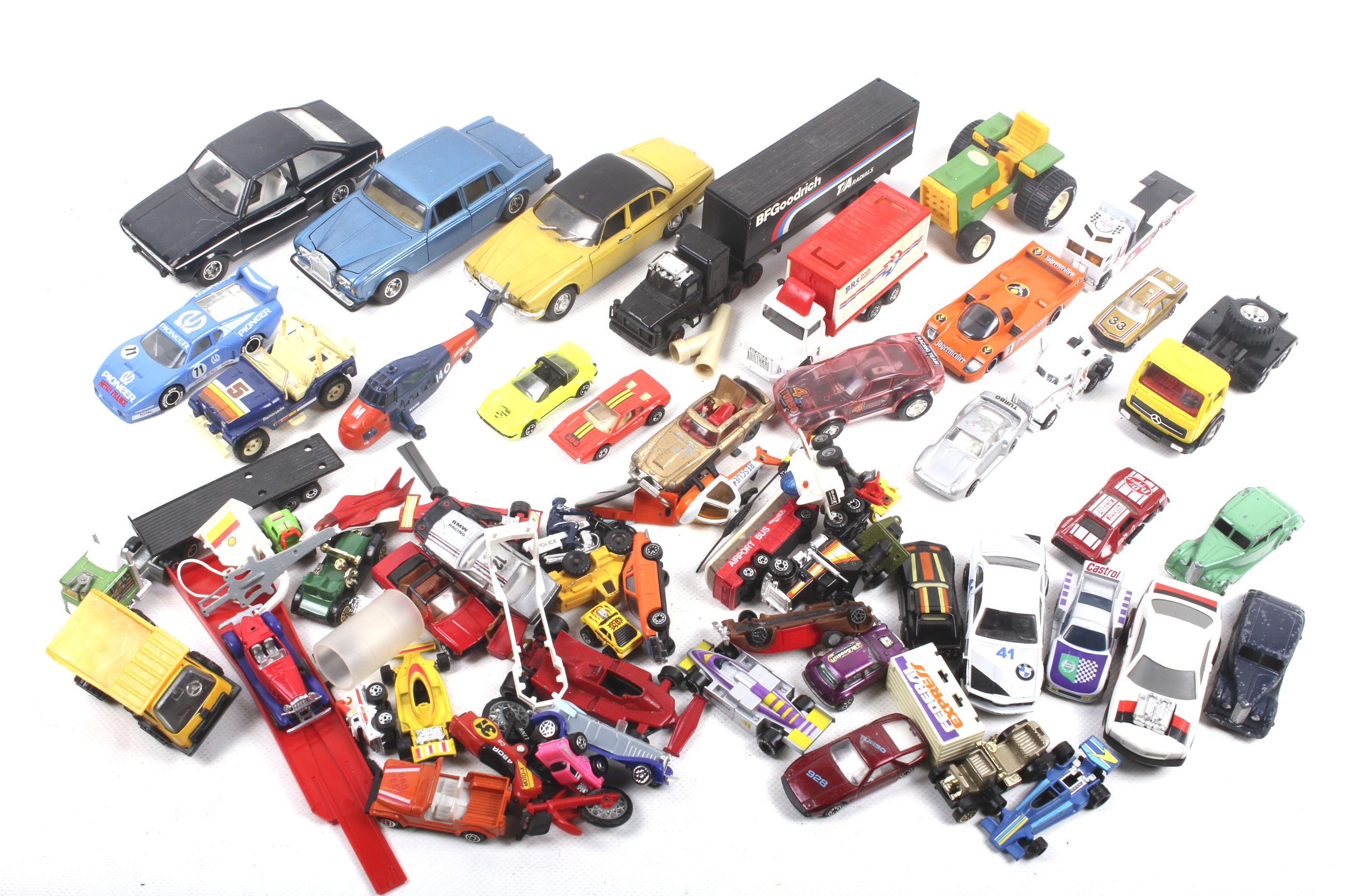 A collection of unboxed diecast vehicles.