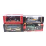 Four 1:18 scale diecast cars.