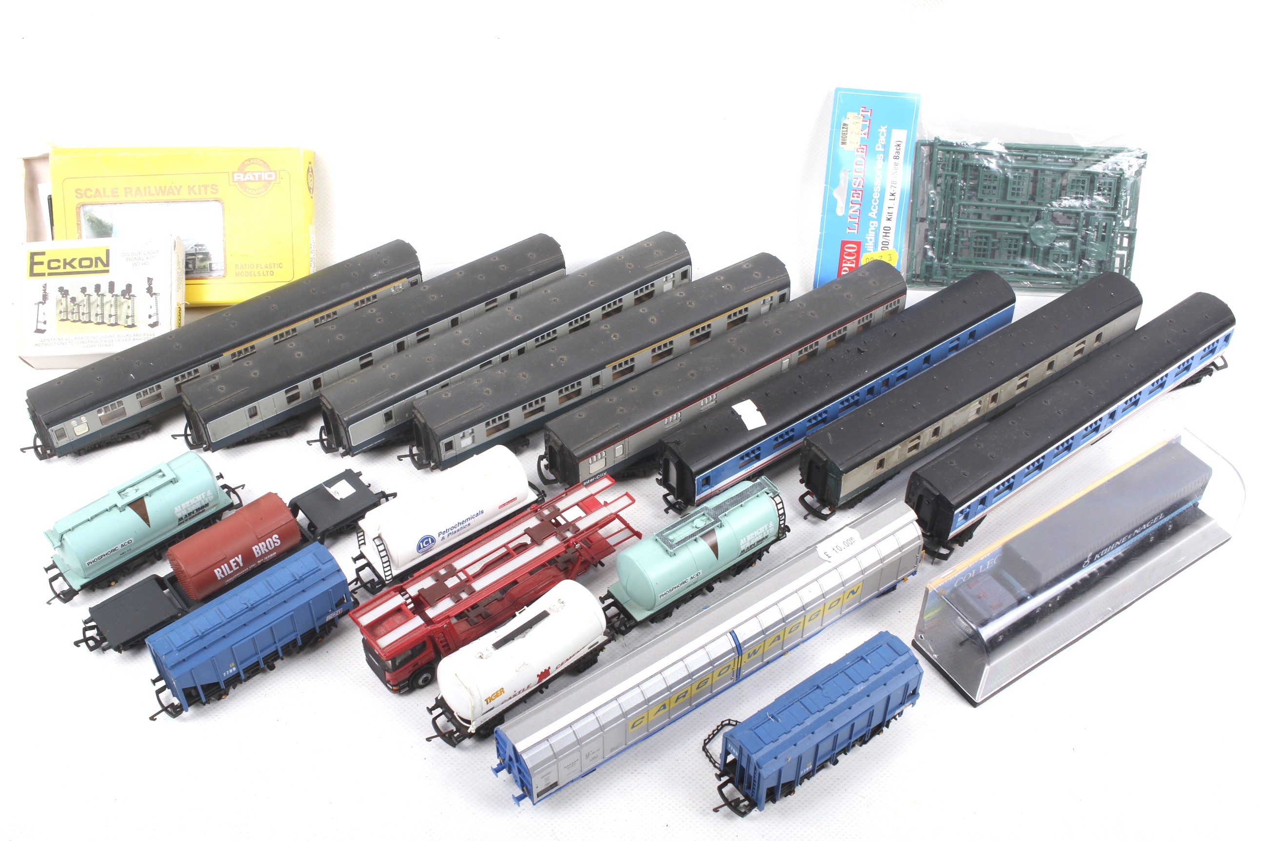 A mixed OO gauge collection of unboxed coaches and wagons. Good range of coaches qty 15.