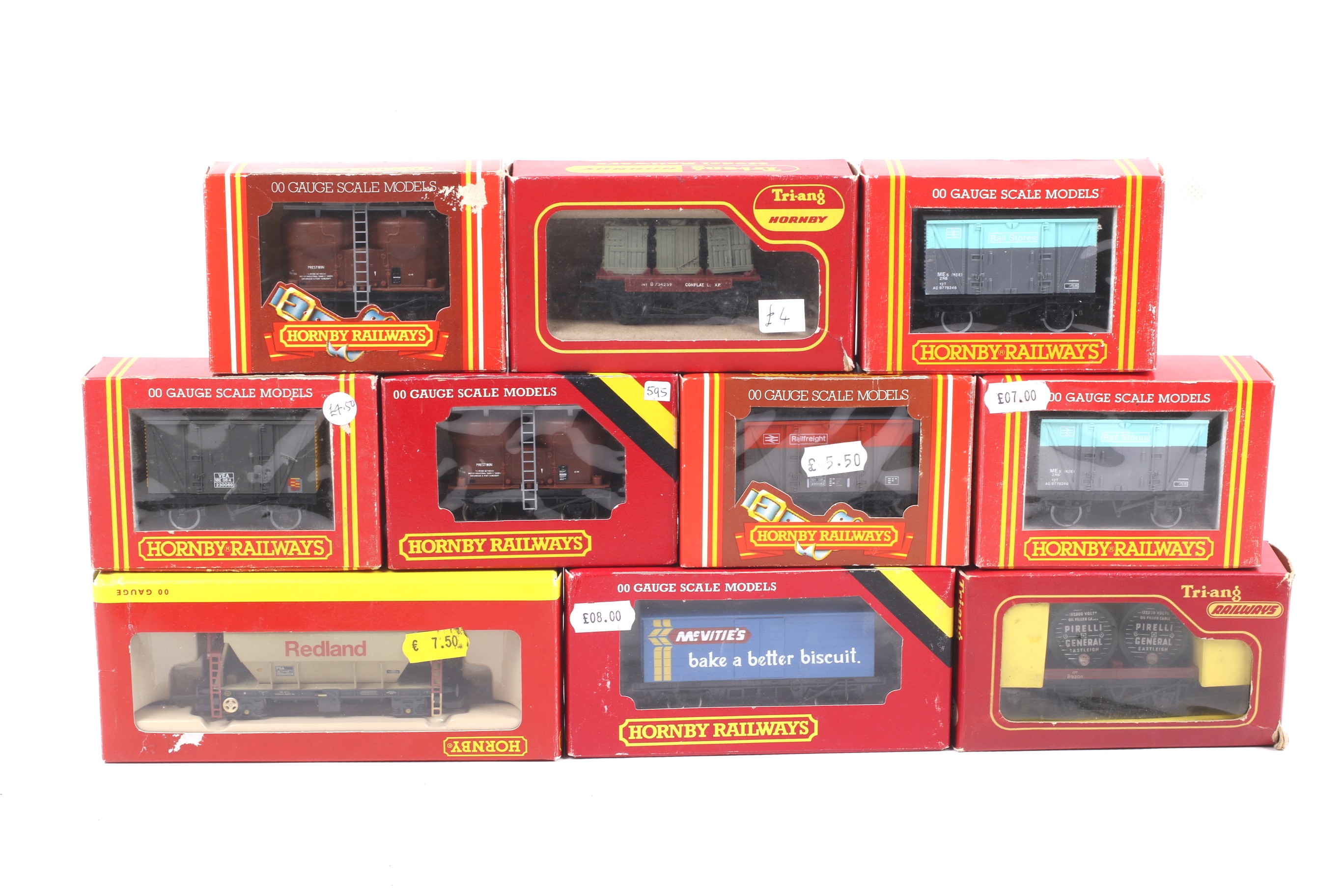 Ten Hornby OO gauge goods wagons. Featuring box cars and containers etc, all in original boxes.