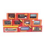 Ten Hornby OO gauge goods wagons. Featuring box cars and containers etc, all in original boxes.