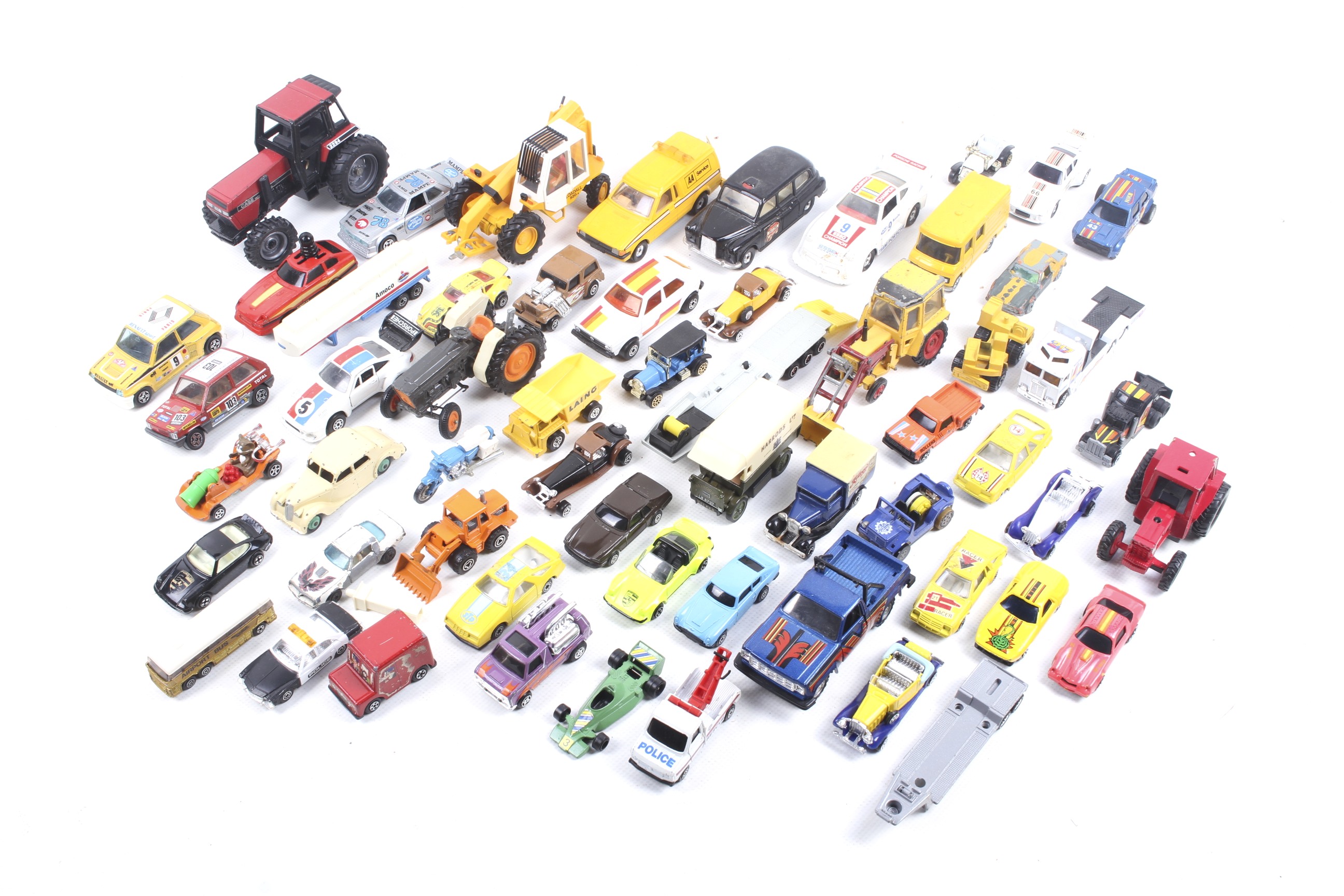 A collection of unboxed diecast vehicles.
