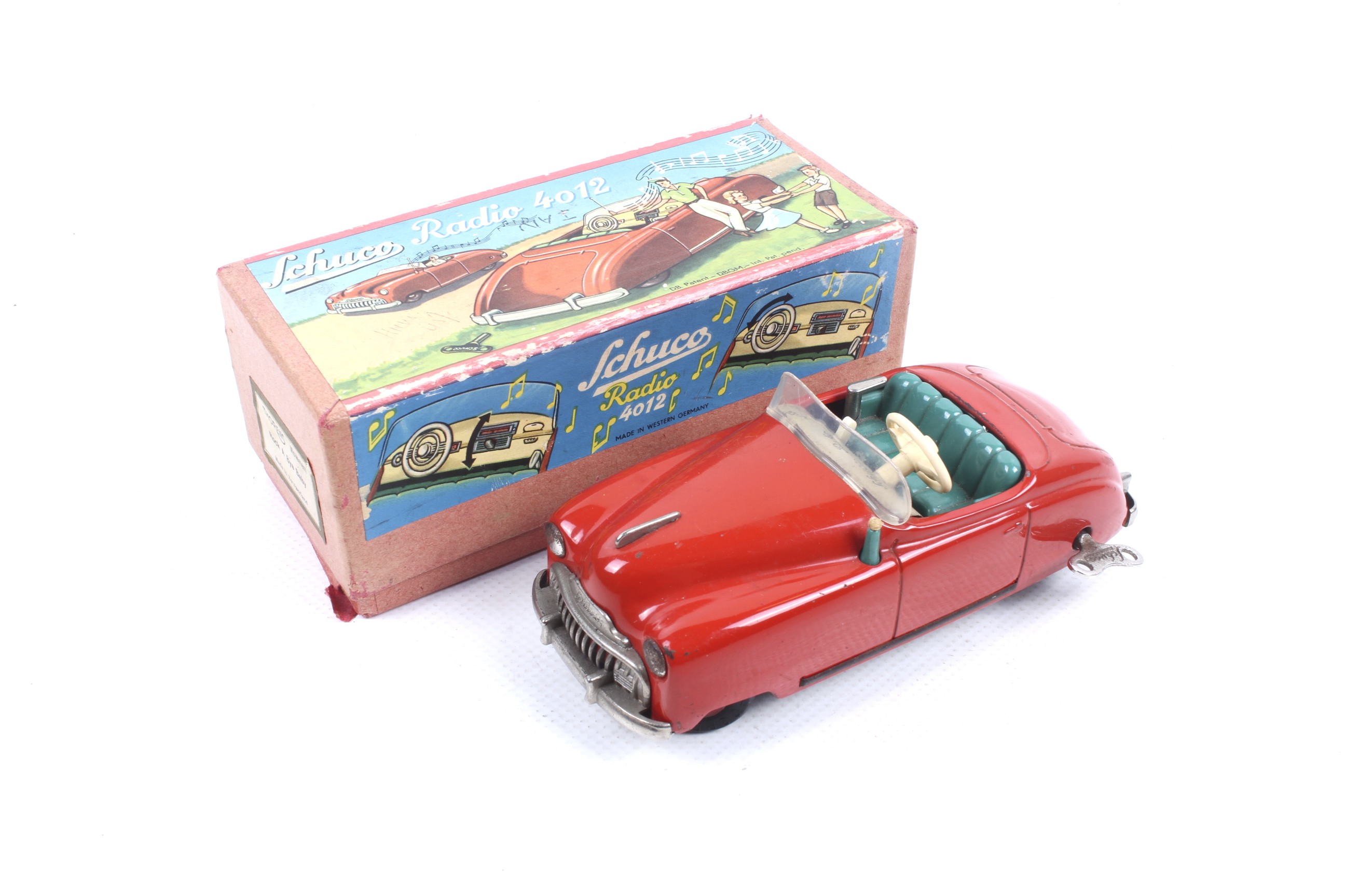 A clockwork Schuco Radio diecast car. No.