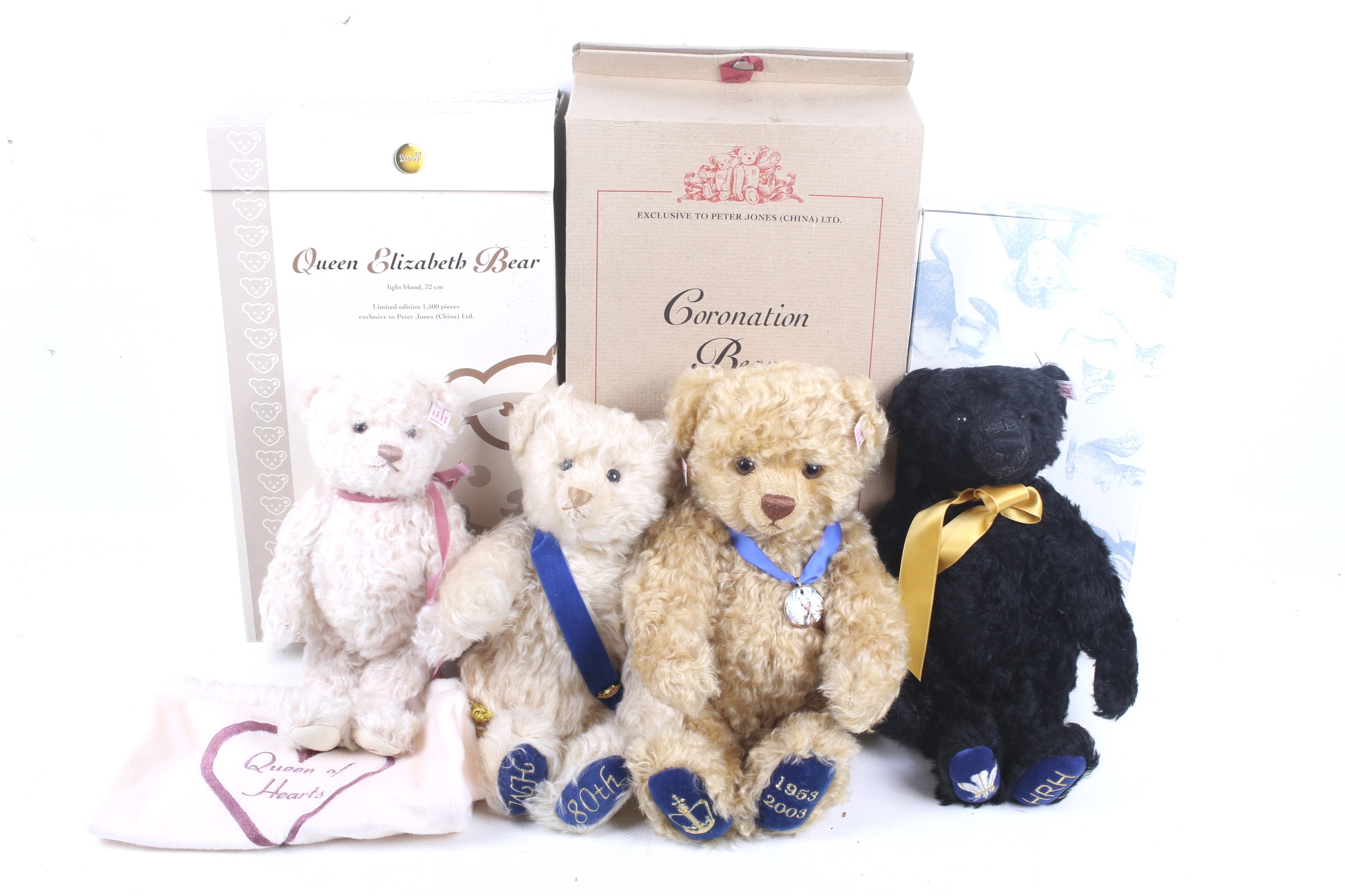 A collection of four Steiff teddy bears.